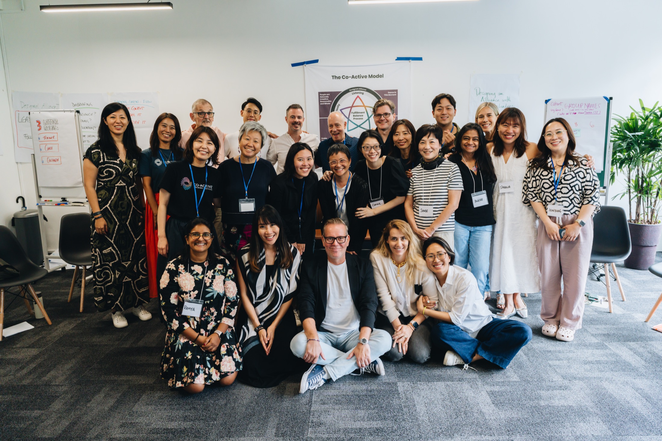 The full cohort together after an in-person leadership training in Singapore