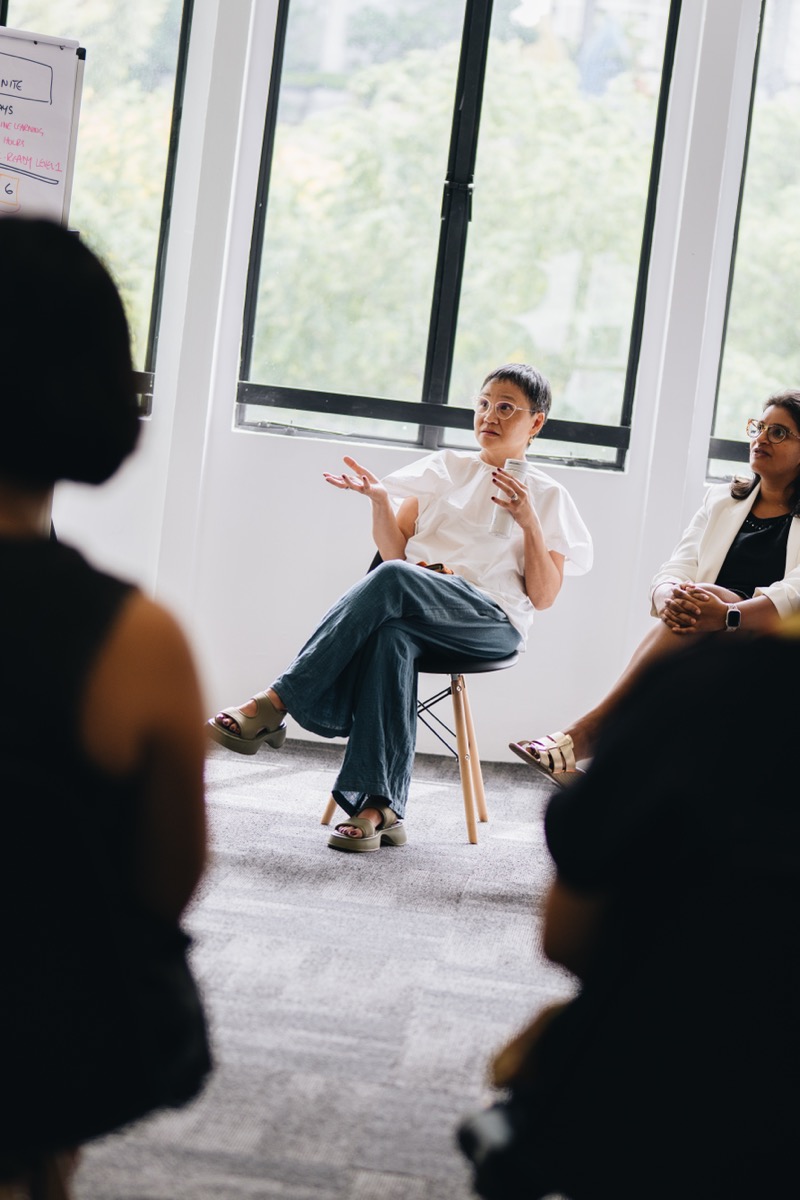 A leader practicing coaching skills in a live circle