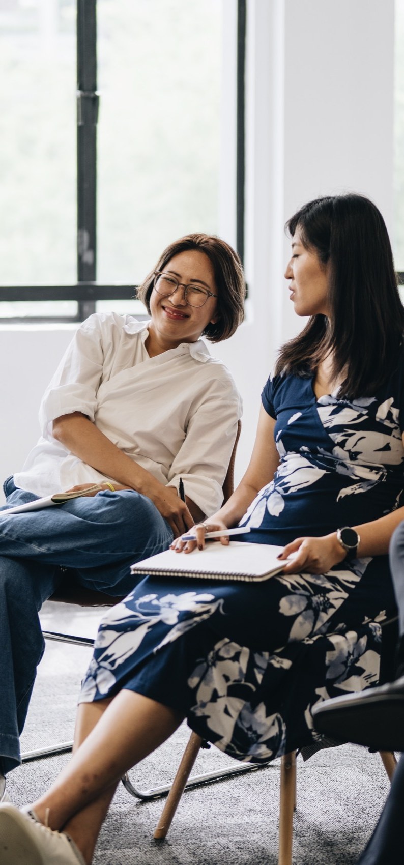 Participants in warm conversation during an MBA program