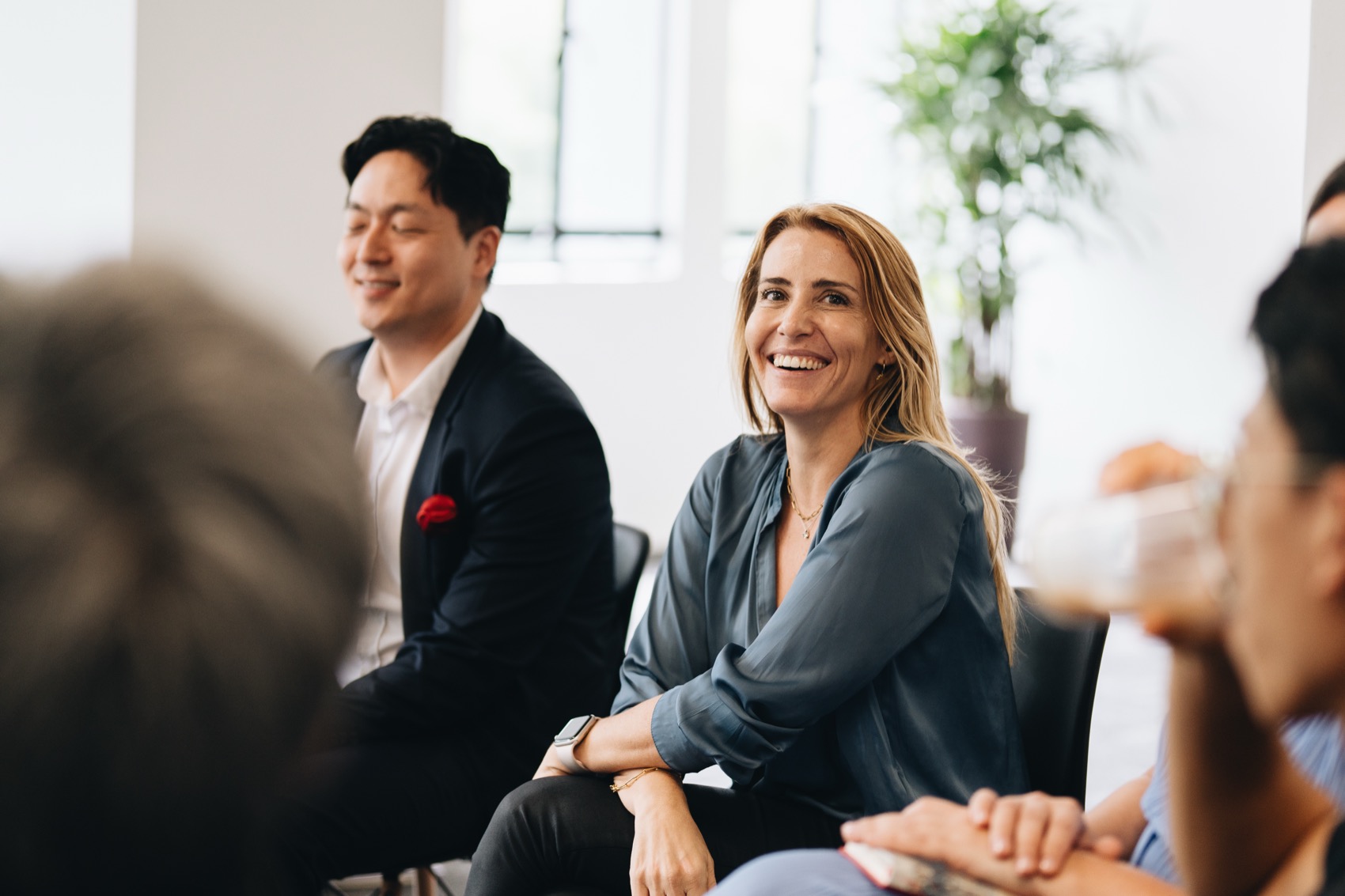 A leader smiling during an MBA training session
